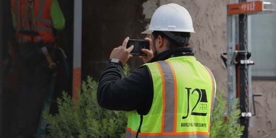 J2-Services-Page-Header_building-consultant-taking-photo-2